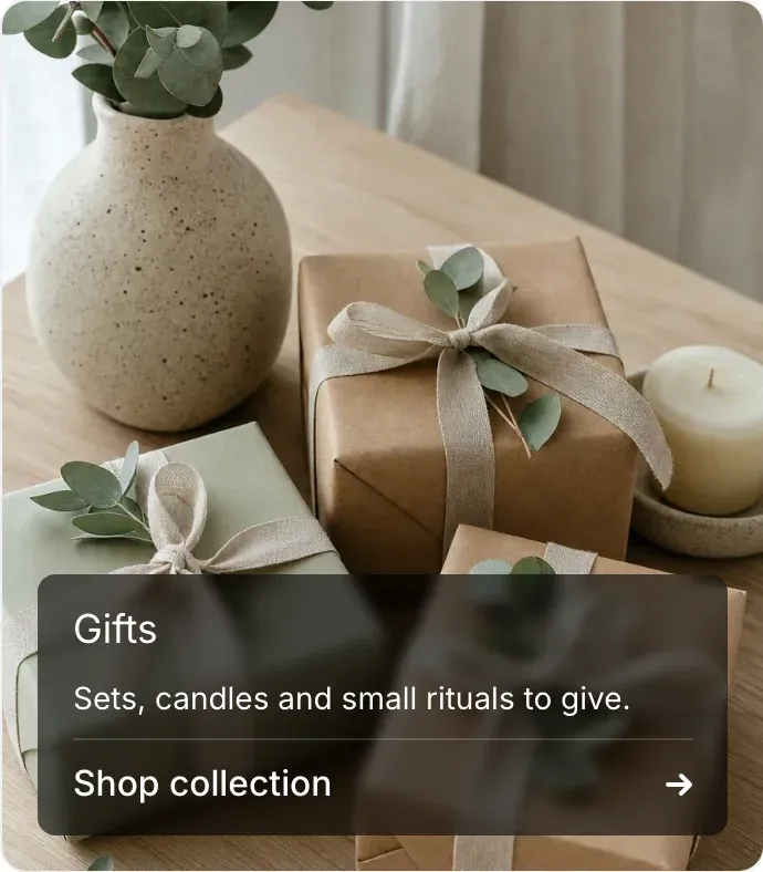The collection tile on hover: the caption shows the title “Gifts”, a one-line description and a Shop collection link with an arrow.